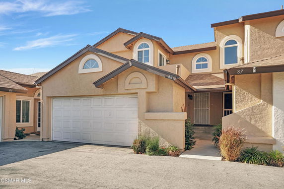 Front view of a two-story house with a double garage.