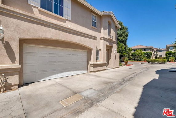 Front view of a two-story house with a double garage.