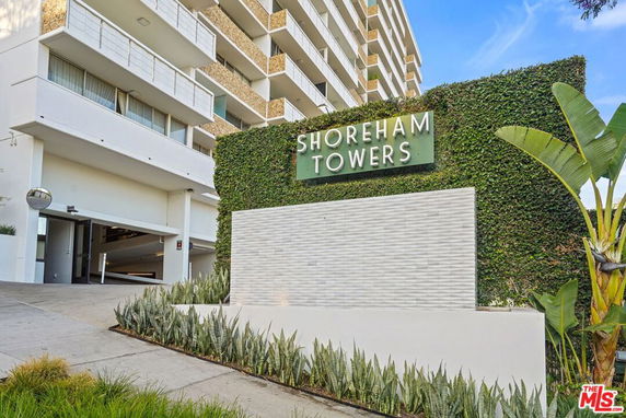 Front view of a multi-story residential building named Shoreham Towers.