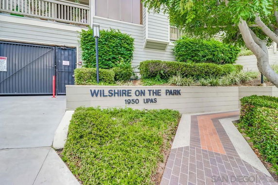 Front view of a building with signage 'Wilshire on the Park'.