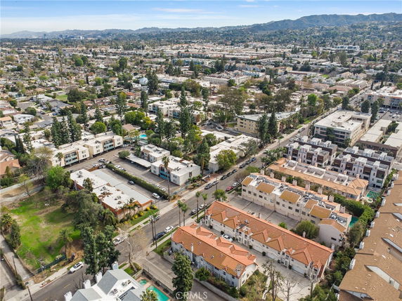 Aerial view of a residential area with multiple buildings and streets.