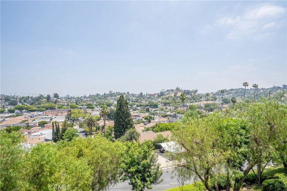 Elevated view of a residential area with numerous houses and trees.