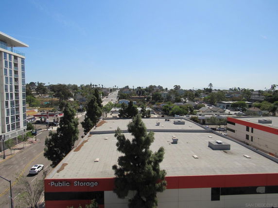 Panoramic view of cityscape with buildings and roads.