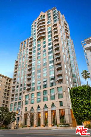 Front view of a high-rise building with multiple balconies.
