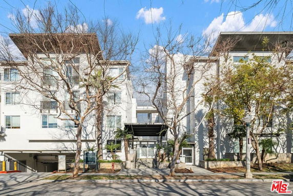Front view of a multi-story modern apartment building