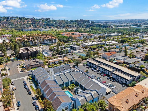 Aerial view of a residential area with multiple buildings and streets.