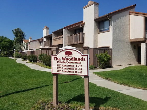 Front view of a multi-story residential community building.