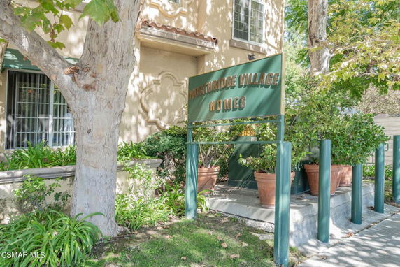 Front view of a residential building with a sign indicating Northridge Village Homes.