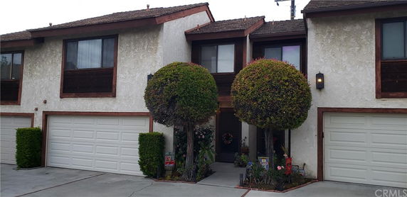 Front view of a two-story house with a double garage.