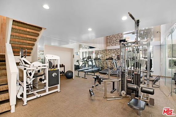 Indoor gym area with various exercise equipment.