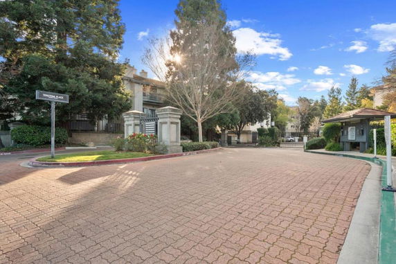 Front view of a gated residential complex entrance.