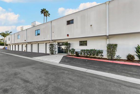 Front view of a building with multiple garage doors.