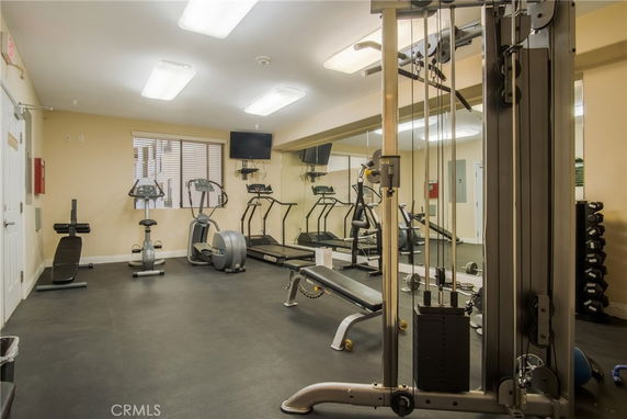 Interior view of a fitness room with exercise equipment.