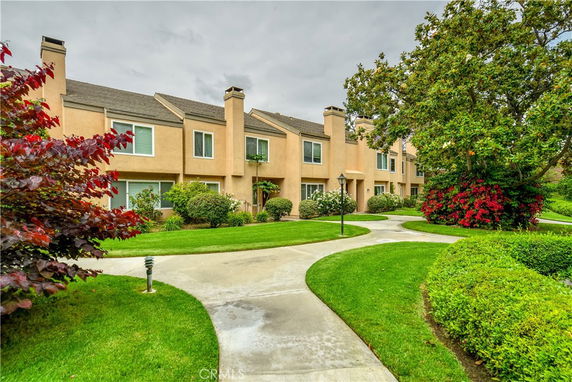 Front view of a multi-story townhouse complex.