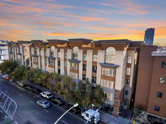 Front view of a multi-story apartment building with a modern design.