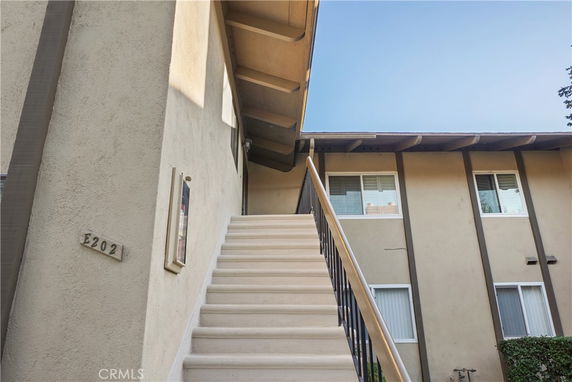 View of an exterior staircase leading to the upper level of a building.