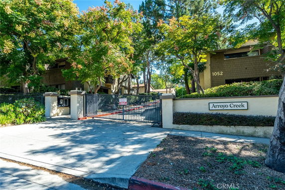 Front view of a gated apartment complex.