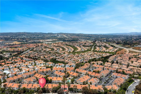 Panoramic view of a residential area with numerous houses and roads.