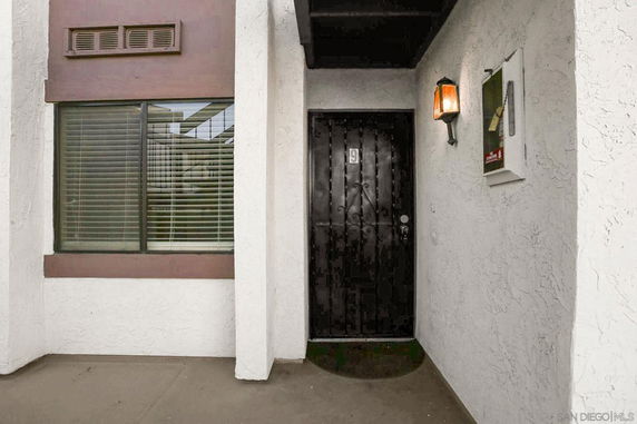 Front entrance of a building with a number 9 on the door.