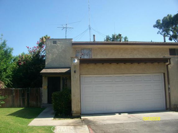 Front view of a two-story house with a double garage.