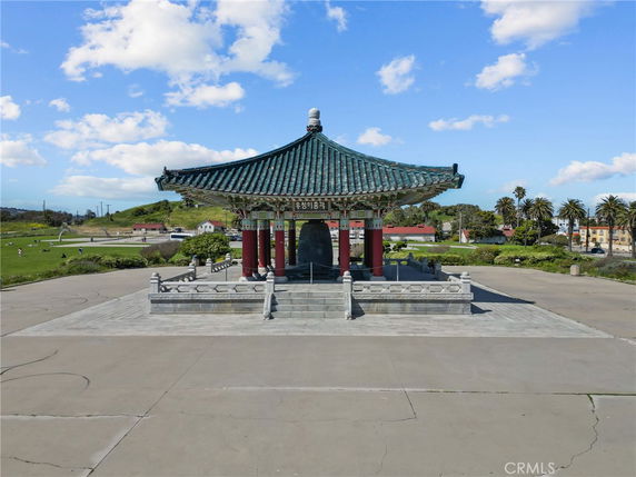 Front view of a pavilion with a traditional Asian-style roof.