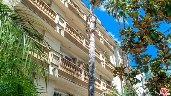 Exterior view of a multi-story building with balconies.