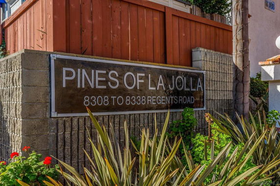 Sign for 'Pines of La Jolla' with surrounding plants