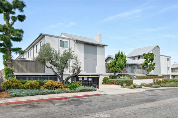 Front view of a multi-story residential building with a modern design.