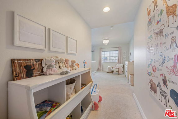 Children's play area with toys and educational wall art