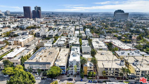 Aerial view of an urban area with multiple residential and commercial buildings.