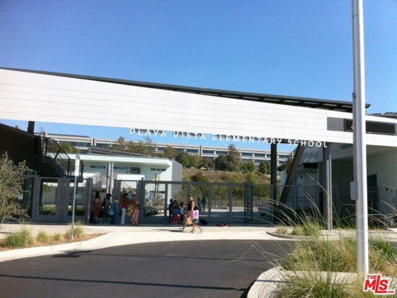 Front view of Playa Vista Elementary School building with entrance gate and signage.