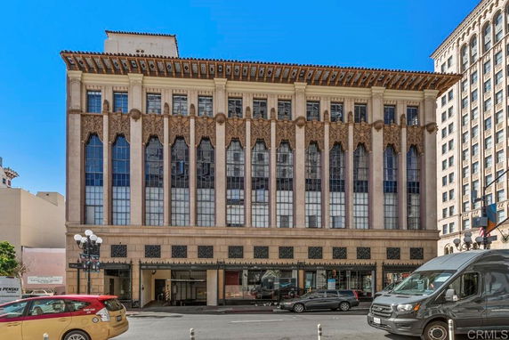 Front view of a multi-story building with decorative architectural features.