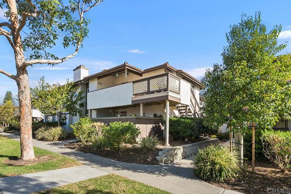 Front view of a two-story residential building with balconies.