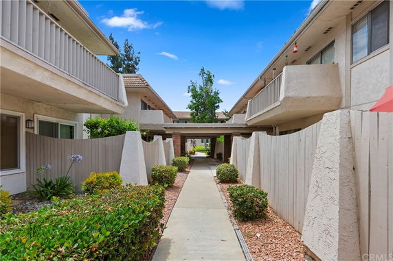 Front view of a two-story residential building with balconies.