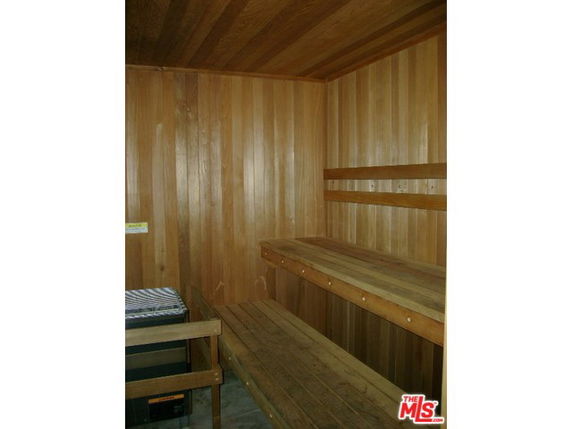 Interior view of a wooden sauna room with benches.