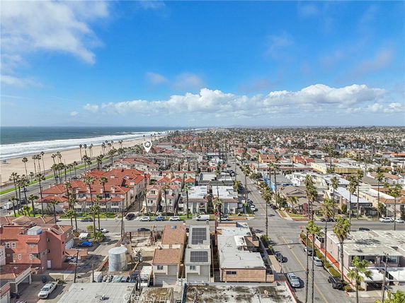 Panoramic view of a coastal residential area with the ocean on one side.