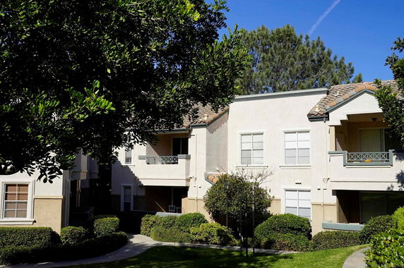 Front view of a two-story residential building with balconies.