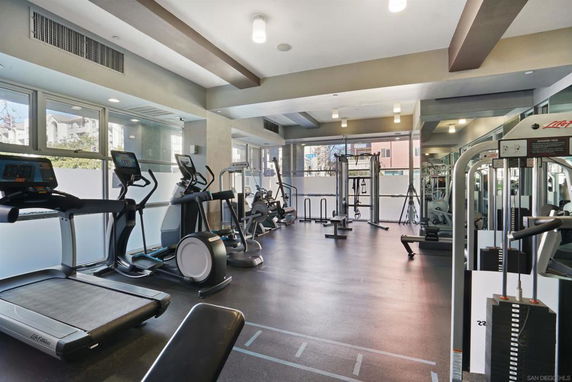 Interior view of a gym with various exercise equipment.