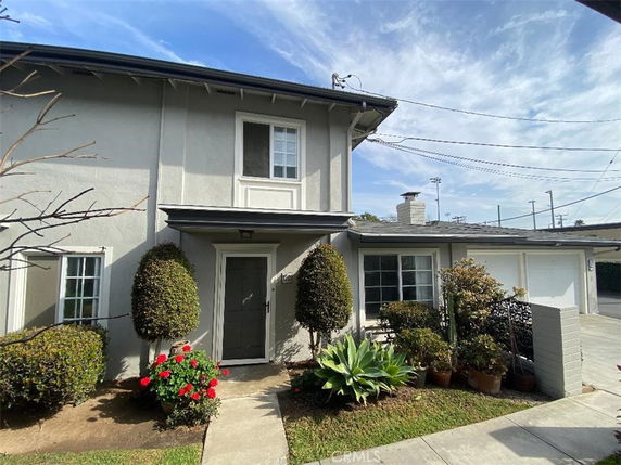 Front view of a two-story house with a garage.