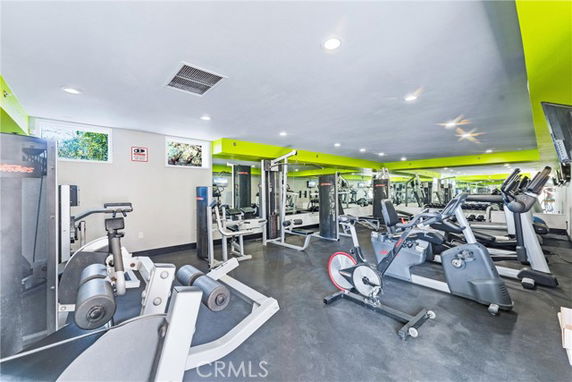 Indoor gym area with various exercise equipment.