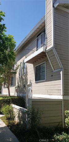 Angled view of a multi-story building with balconies.