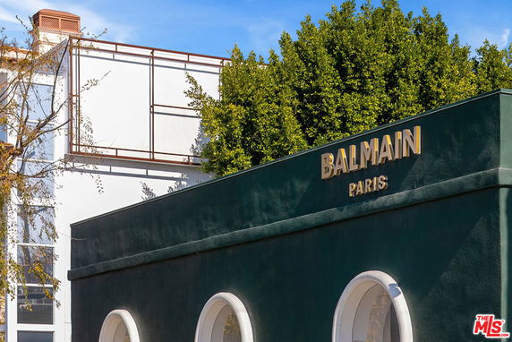 Front view of a building with Balmain Paris signage.