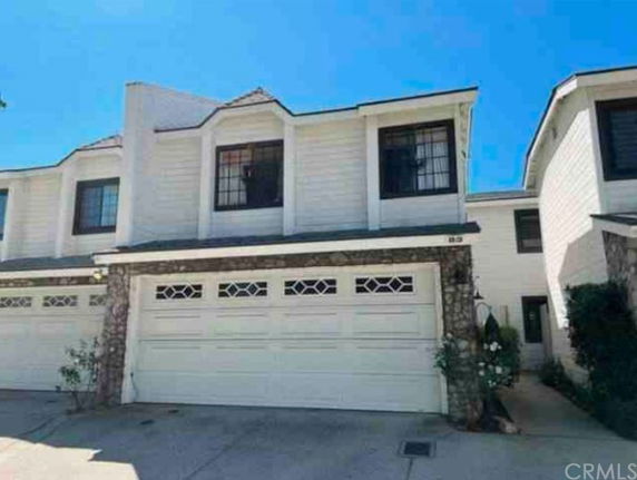 Front view of a two-story house with a double garage.