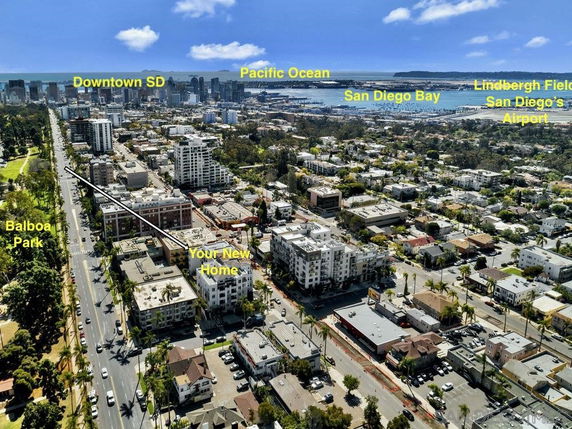 Elevated view of a city area with buildings and labels indicating landmarks like Balboa Park, Downtown SD, and San Diego Bay.