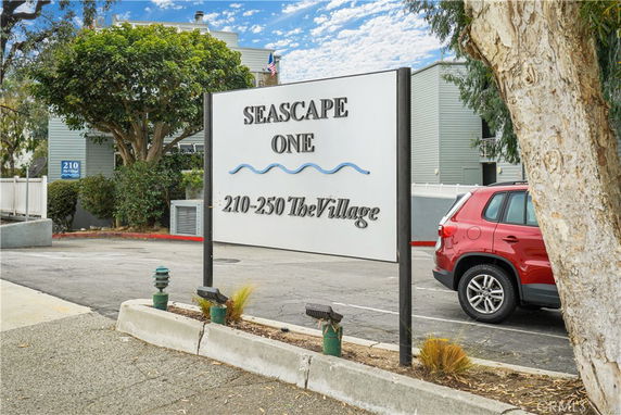 Front view of a residential building with a sign reading Seascape One.