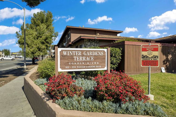 Front view of a condominium with signage for Winter Gardens Terrace.