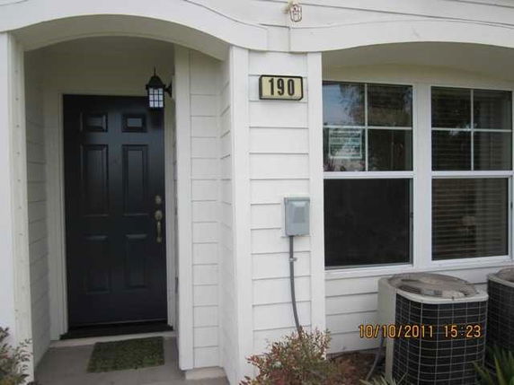 Front view of a house with a dark front door and number 190.