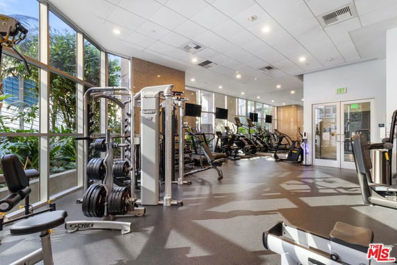 Interior view of a gym area with exercise equipment.