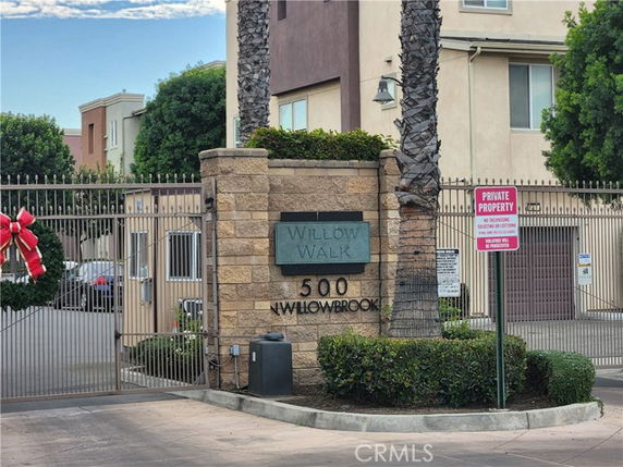 Entrance to a residential building complex with a gated entry.