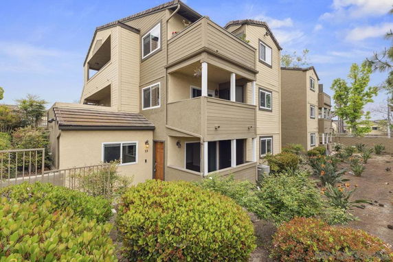 Front view of a multi-story residential building with balconies.
